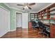 Office with built-in shelving, hardwood floors, and dual desks for flexible work arrangements at 29324 Leah Rd, Punta Gorda, FL 33982