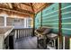 Outdoor tiki bar features a grill, countertop, and a relaxed atmosphere for fun summer gatherings at 29324 Leah Rd, Punta Gorda, FL 33982