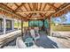 Charming tiki hut featuring a wooden bar, seating, and a relaxed island vibe, ideal for poolside gatherings at 29324 Leah Rd, Punta Gorda, FL 33982