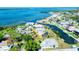 Aerial view showcasing the property's waterfront location and dock on a scenic canal at 352 Oak St, Englewood, FL 34223