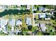 Aerial view highlighting the property boundaries and waterfront access with a canal and dock at 352 Oak St, Englewood, FL 34223