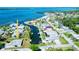 Stunning aerial view of a waterfront home with boat dock on a canal with ocean access at 352 Oak St, Englewood, FL 34223