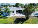 Aerial view of the property showing an immaculate lawn, great roof, and a beautiful home at 352 Oak St, Englewood, FL 34223
