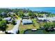 Aerial view of a well-maintained house and waterfront with dock in a desirable neighborhood at 352 Oak St, Englewood, FL 34223