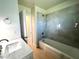 Renovated bathroom with a modern vanity, tiled shower, and updated fixtures at 352 Oak St, Englewood, FL 34223