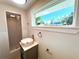 Bright bathroom with vessel sink, modern fixtures, and a walk-in shower at 352 Oak St, Englewood, FL 34223