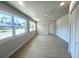 Bright and airy bedroom with tile flooring and natural light from multiple windows at 352 Oak St, Englewood, FL 34223