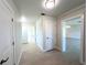 Hallway features tile flooring, white doors, and leads into other rooms at 352 Oak St, Englewood, FL 34223