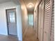 Long hallway with a front door, closet, tile flooring, and overhead lighting at 352 Oak St, Englewood, FL 34223