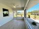 Enclosed lanai with tile flooring offering views of the surrounding landscape at 352 Oak St, Englewood, FL 34223