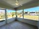 Screened-in lanai with tile flooring and waterfront views at 352 Oak St, Englewood, FL 34223