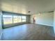 Spacious living room with tile floors, large windows providing natural light at 352 Oak St, Englewood, FL 34223