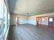 Spacious living room with tile floors, large windows providing natural light at 352 Oak St, Englewood, FL 34223