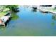 View of the canal waterfront with a dock, providing direct access to the open water at 352 Oak St, Englewood, FL 34223