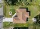 Aerial view of house showcasing lush backyard with shed and mature landscaping at 3621 Jade St, North Port, FL 34288