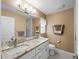 Bathroom features a double sink vanity with granite countertops and modern fixtures, offering functionality and style at 3621 Jade St, North Port, FL 34288