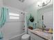 Bathroom featuring a shower-tub combination, decorative tile, and vanity with a granite countertop at 3621 Jade St, North Port, FL 34288