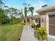 Charming home featuring clean lines, manicured landscaping, and a freshly paved walkway at 3621 Jade St, North Port, FL 34288