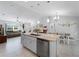 Spacious kitchen island with seating, open to the living and dining areas at 3621 Jade St, North Port, FL 34288