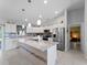 Bright kitchen featuring granite counters, stainless appliances, and pendant lighting at 3621 Jade St, North Port, FL 34288