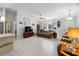 Cozy living room with comfortable seating, tile floors, and abundant natural light at 3621 Jade St, North Port, FL 34288