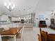 Open-concept kitchen and living area with stylish decor and abundant natural light at 3621 Jade St, North Port, FL 34288