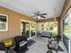 Cozy screened-in patio furnished for relaxing and enjoying outdoor living at 3621 Jade St, North Port, FL 34288