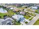 Aerial view of a planned community showcasing golf course, lakes, and diverse home styles at 3712 Carmichael Dr, Punta Gorda, FL 33950
