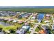 Breathtaking aerial perspective capturing waterfront living, a golf course, and a serene lake at 3712 Carmichael Dr, Punta Gorda, FL 33950