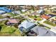 An aerial view of a home with a screened-in pool located on a pristine waterfront property at 3712 Carmichael Dr, Punta Gorda, FL 33950