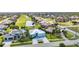 Scenic aerial shot highlighting the golf course and tranquil lake in a residential community at 3712 Carmichael Dr, Punta Gorda, FL 33950