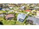 Aerial view of a stunning waterfront home with a screened pool in a vibrant and well-maintained neighborhood at 3712 Carmichael Dr, Punta Gorda, FL 33950