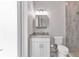 Modern bathroom with granite vanity, walk-in shower with glass door, and updated fixtures at 3712 Carmichael Dr, Punta Gorda, FL 33950