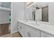 Primary bathroom with double vanity, stylish lighting, and views to bedroom and shower at 3712 Carmichael Dr, Punta Gorda, FL 33950