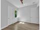 Minimalist bedroom featuring tile flooring and natural lighting from the window at 3712 Carmichael Dr, Punta Gorda, FL 33950