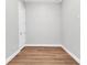 Neutral bedroom space with wood look tile floor, neutral wall paint, and base trim at 3712 Carmichael Dr, Punta Gorda, FL 33950