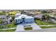 Stunning property boasting a paved driveway, well-kept lawn, and community golf course scenery at 3712 Carmichael Dr, Punta Gorda, FL 33950