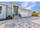 Attractive home with an open entryway featuring an oversized two car garage and lovely pavers at 3712 Carmichael Dr, Punta Gorda, FL 33950