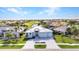 Charming new home featuring a paved driveway, pristine landscaping, and a golf course view at 3712 Carmichael Dr, Punta Gorda, FL 33950