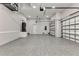 Spacious three-car garage with epoxy flooring offering ample storage and parking at 3712 Carmichael Dr, Punta Gorda, FL 33950