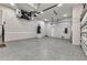Spacious garage with epoxy flooring and ample storage space, ready for any hobby or vehicle collection at 3712 Carmichael Dr, Punta Gorda, FL 33950