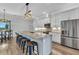 Modern eat-in kitchen featuring an island, granite countertops, and stainless-steel appliances at 3712 Carmichael Dr, Punta Gorda, FL 33950