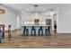 Open-concept eat-in kitchen with an island, pendant lighting, and stainless-steel appliances at 3712 Carmichael Dr, Punta Gorda, FL 33950