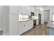 Gourmet kitchen features stainless appliances, granite countertops, and custom backsplash at 3712 Carmichael Dr, Punta Gorda, FL 33950