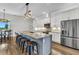 Modern eat-in kitchen with a large island, granite countertops, and stainless steel appliances at 3712 Carmichael Dr, Punta Gorda, FL 33950