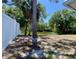 View of the backyard showcasing a privacy fence and serene water view at 3721 Adelaide Ave, North Port, FL 34288
