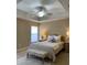 Neutral bedroom with tray ceiling and a light-colored patterned rug under the bed at 3721 Adelaide Ave, North Port, FL 34288