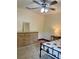 Charming bedroom with a ceiling fan, dresser, nightstand, and a cozy bed with strawberry-themed bedding at 3721 Adelaide Ave, North Port, FL 34288