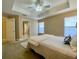 Neutral bedroom with tray ceiling and a light-colored patterned rug under the bed at 3721 Adelaide Ave, North Port, FL 34288
