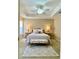 Cozy bedroom with a tray ceiling, neutral tones, and elegant furnishings at 3721 Adelaide Ave, North Port, FL 34288